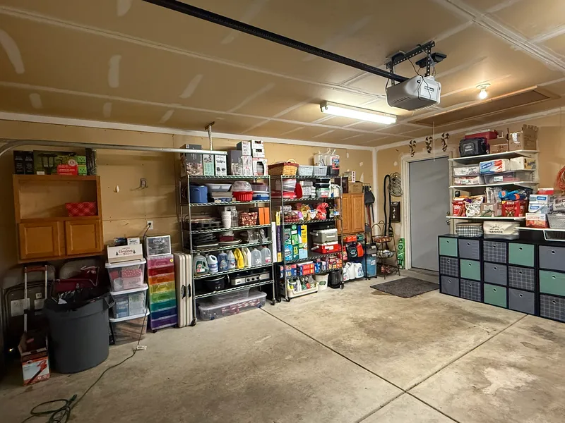 Completed Indianapolis garage with reused shelving and cabinets and added cube storage